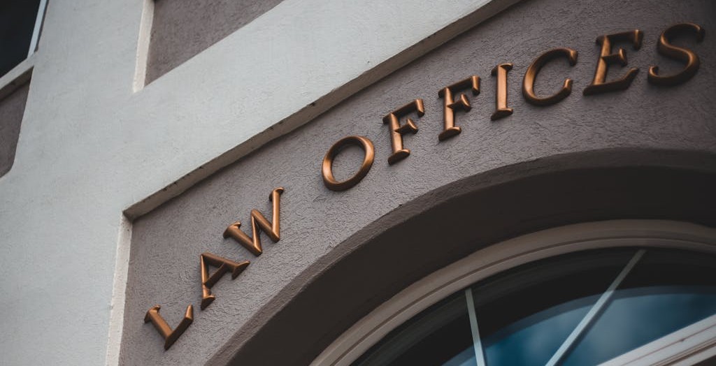 Photo of a building with gold letters spelling 'Law Offices'